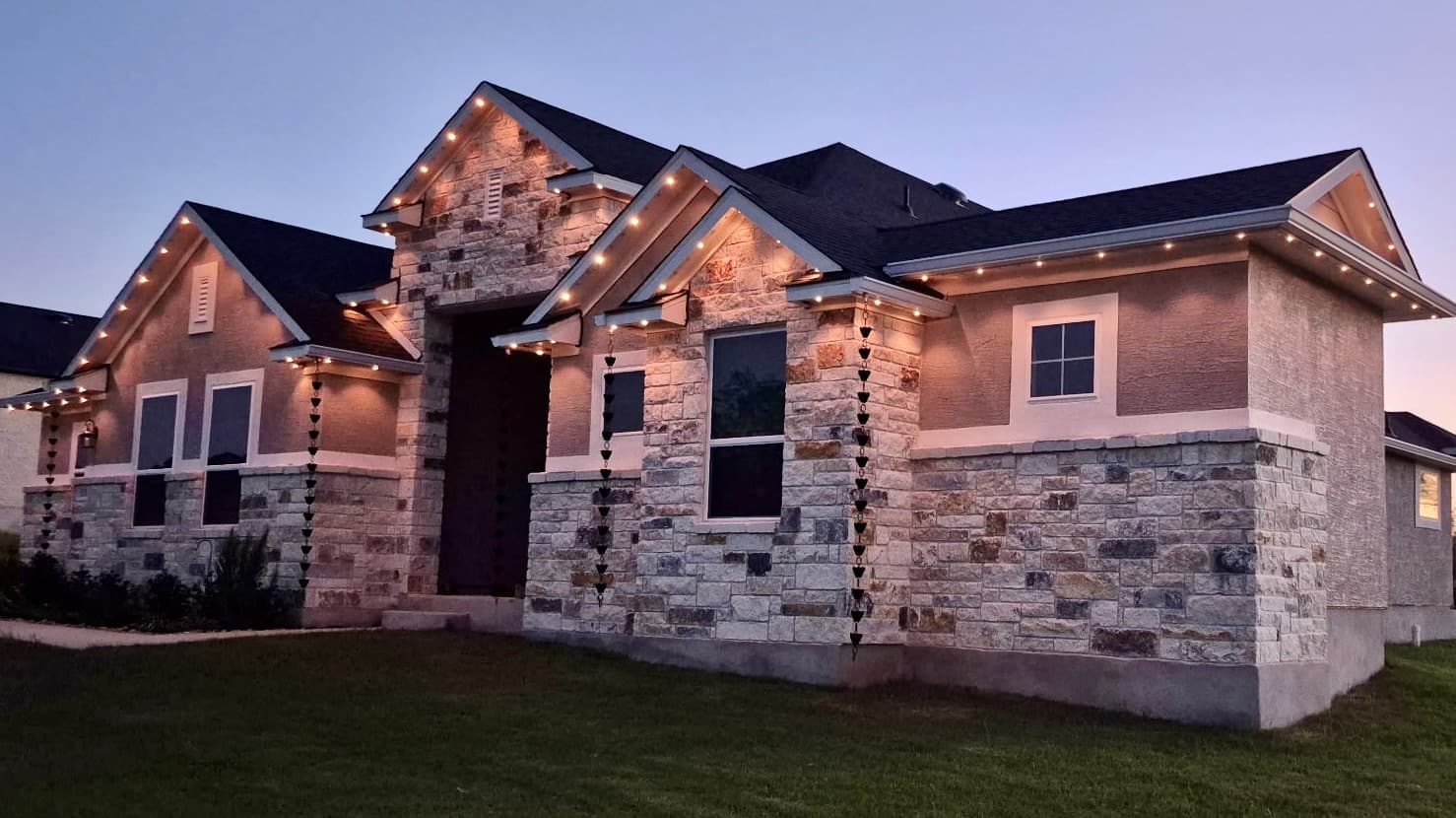 Representative customer-supplied LIT365 installation for the San Antonio service market: a complete facade under warm permanent roofline lighting